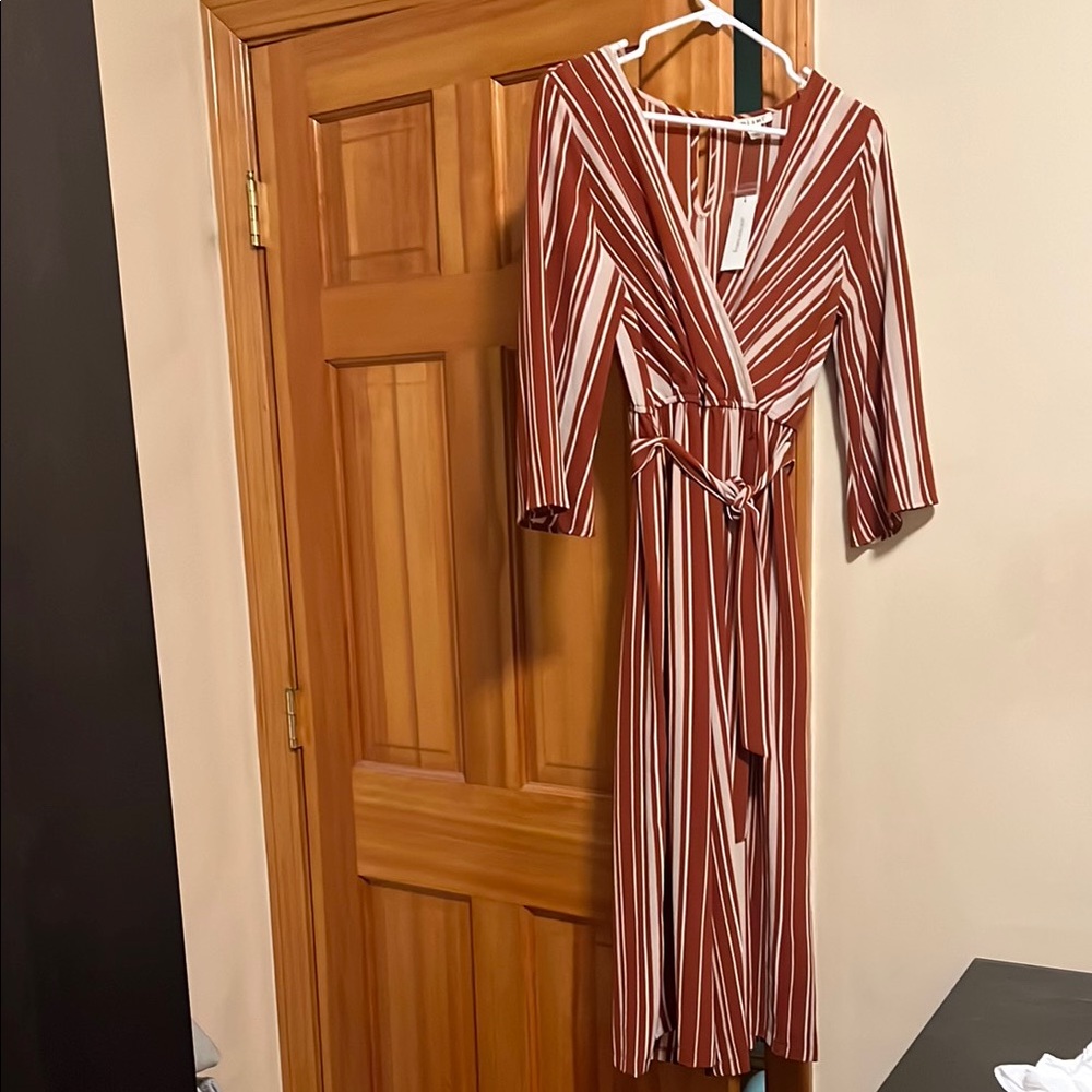 Francesca’s Orange V-Neck Wrap Jumpsuit